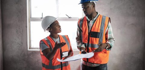 plan-create-construct-shot-young-man-woman-going-building-plans-construction-site
